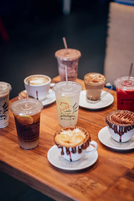 Variety of coffee drinks on a wooden table