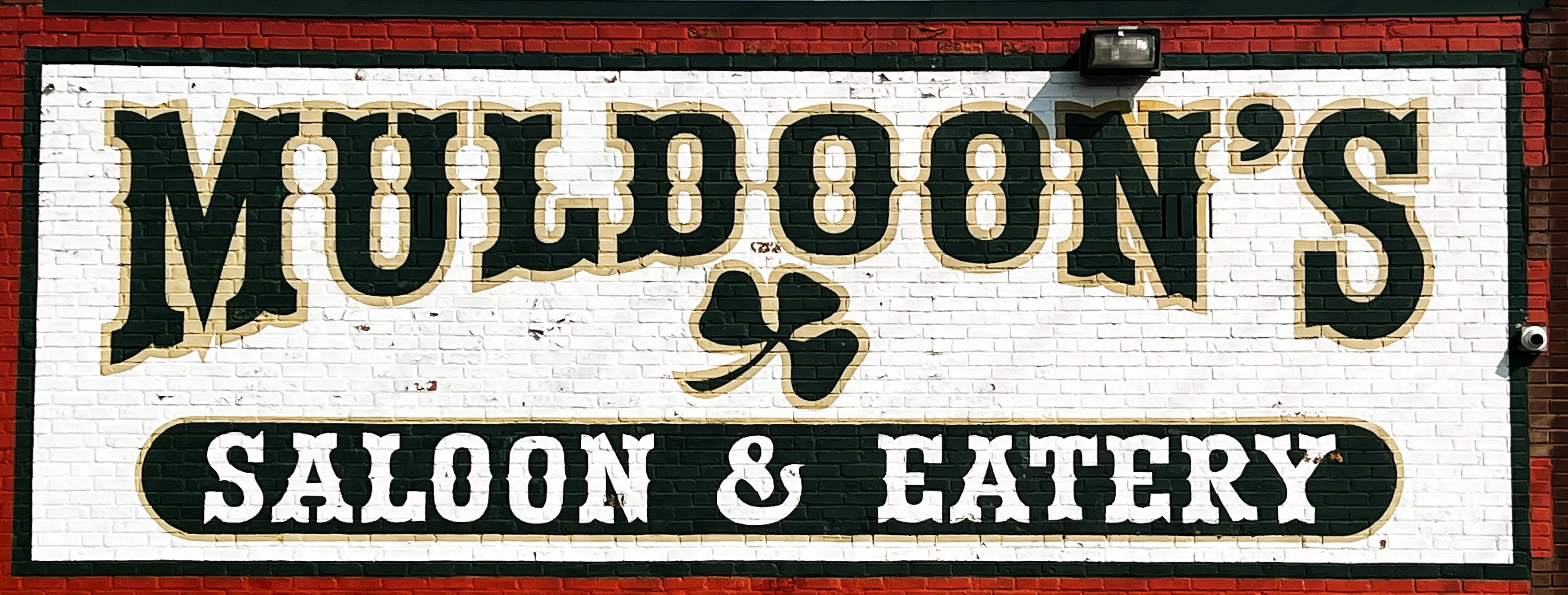 Signage for Muldoon's Saloon & Eatery with vintage style