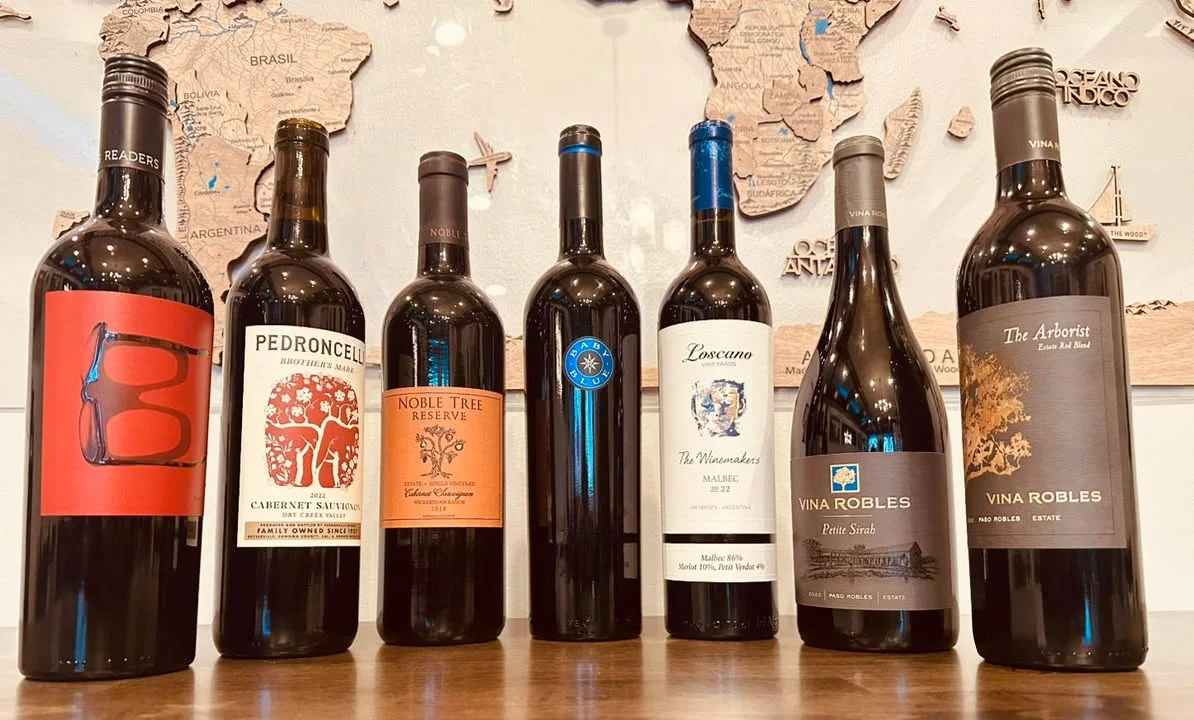 Selection of fine wines displayed on a wooden table