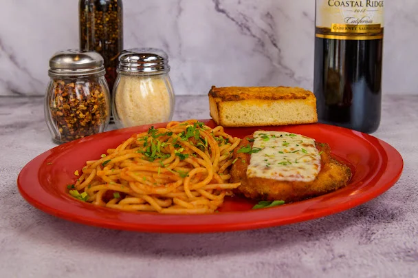 Italian chicken parmesan with spaghetti and garlic bread