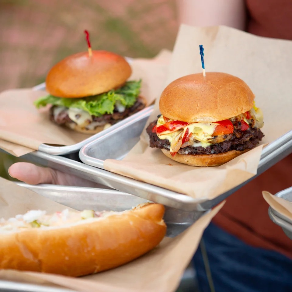 Burgers and hotdog on trays
