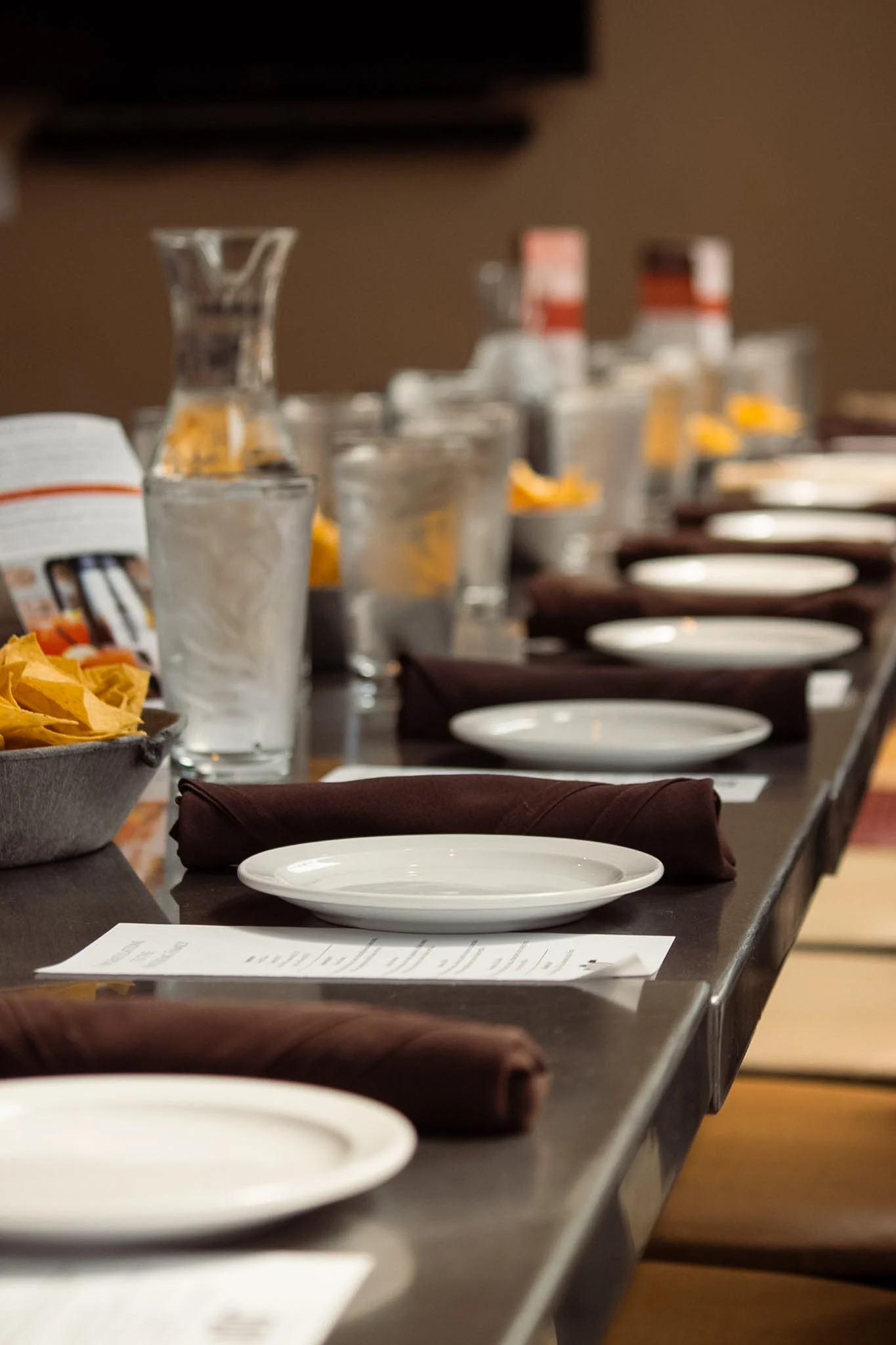 Elegant restaurant dining setup with plates and napkins