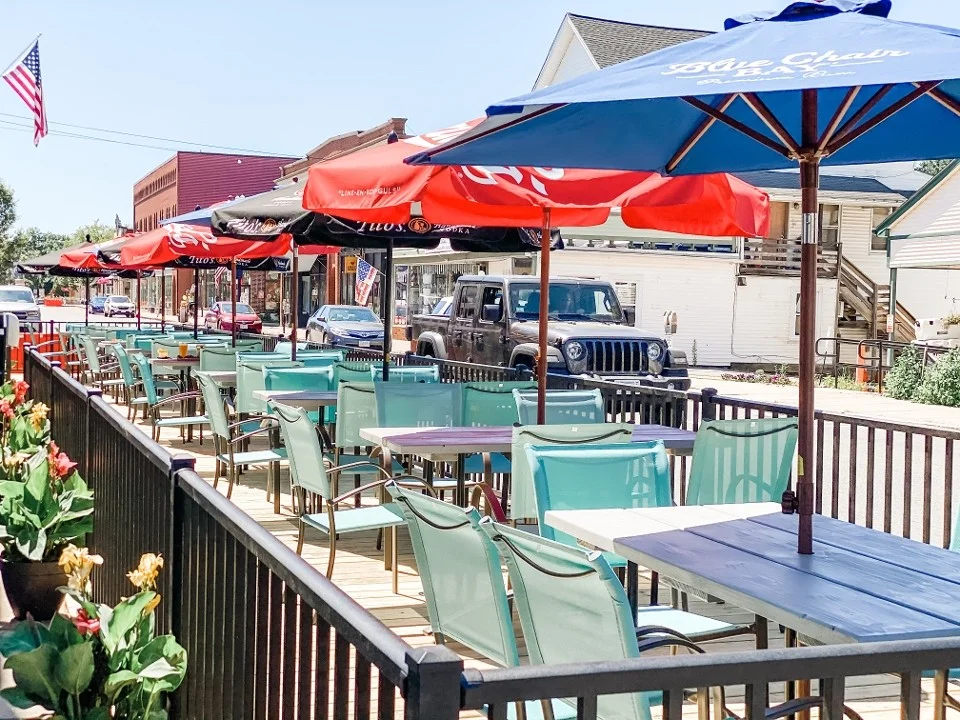 Outdoor dining area with colorful umbrellas and seating