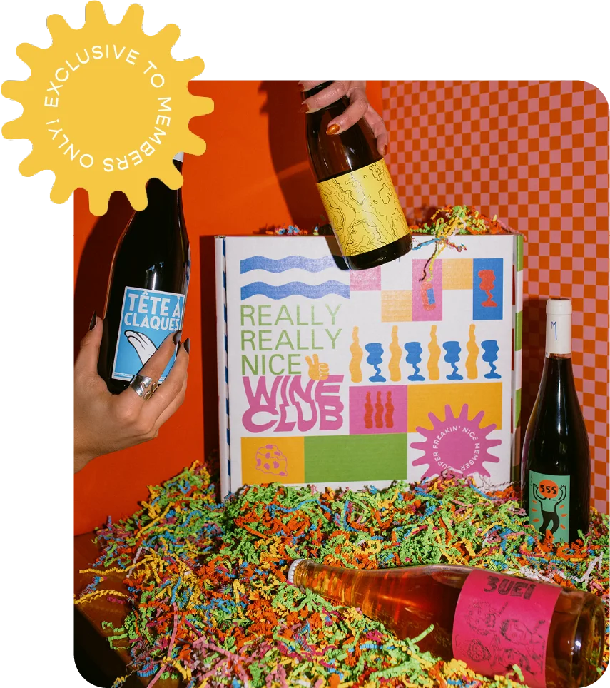 Colorful wine bottles and a vibrant wine club box on a festive background