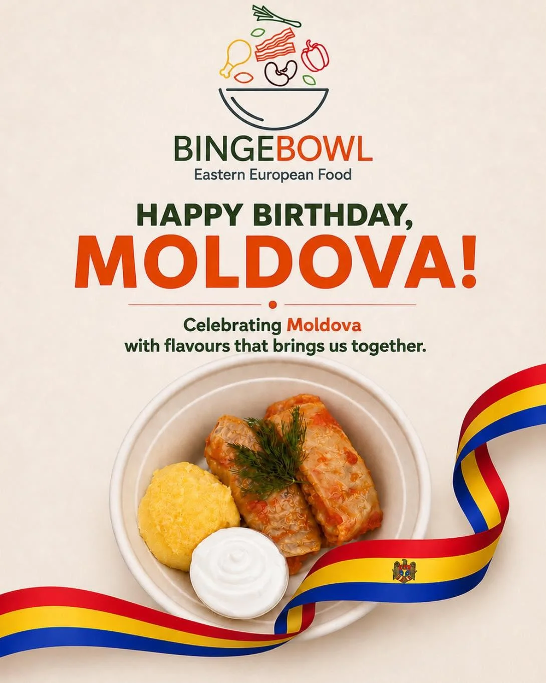 A bowl of traditional Moldovan food featuring stuffed cabbage rolls, a side of polenta, and sour cream, decorated with a colorful ribbon.