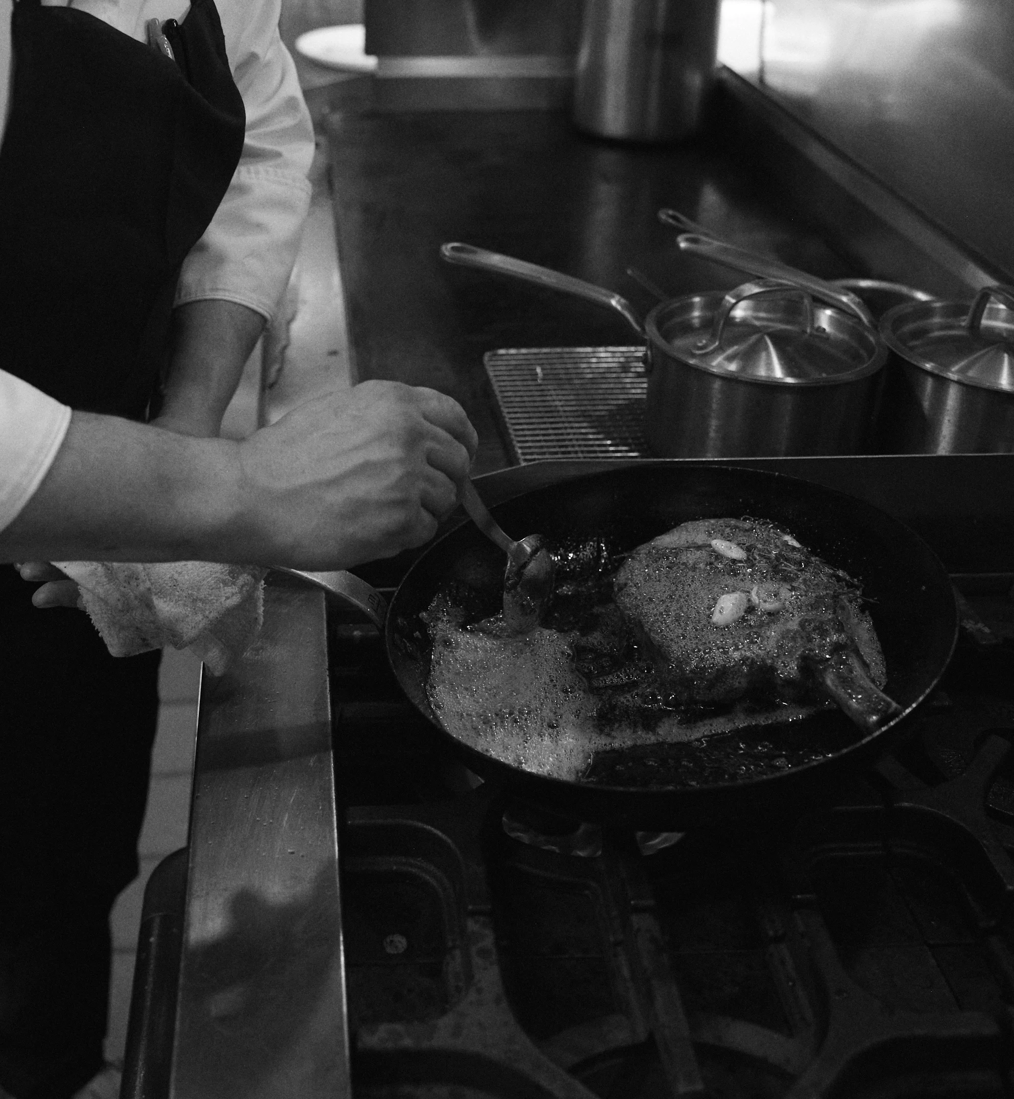 A restaurant chef preparing a dish