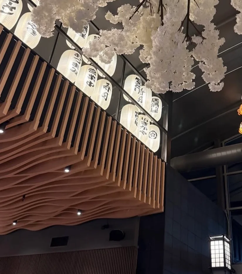 Cozy ramen shop interior with vibrant lanterns and neon decor