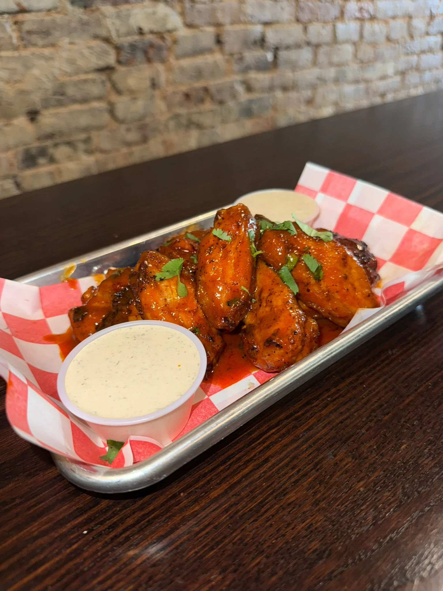 A closeup of wings on a platter