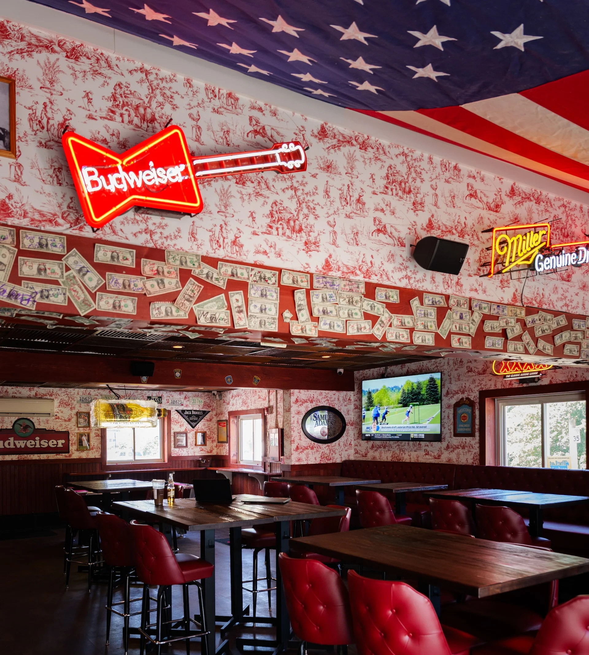 Cozy bar interior with neon signs and rustic decor