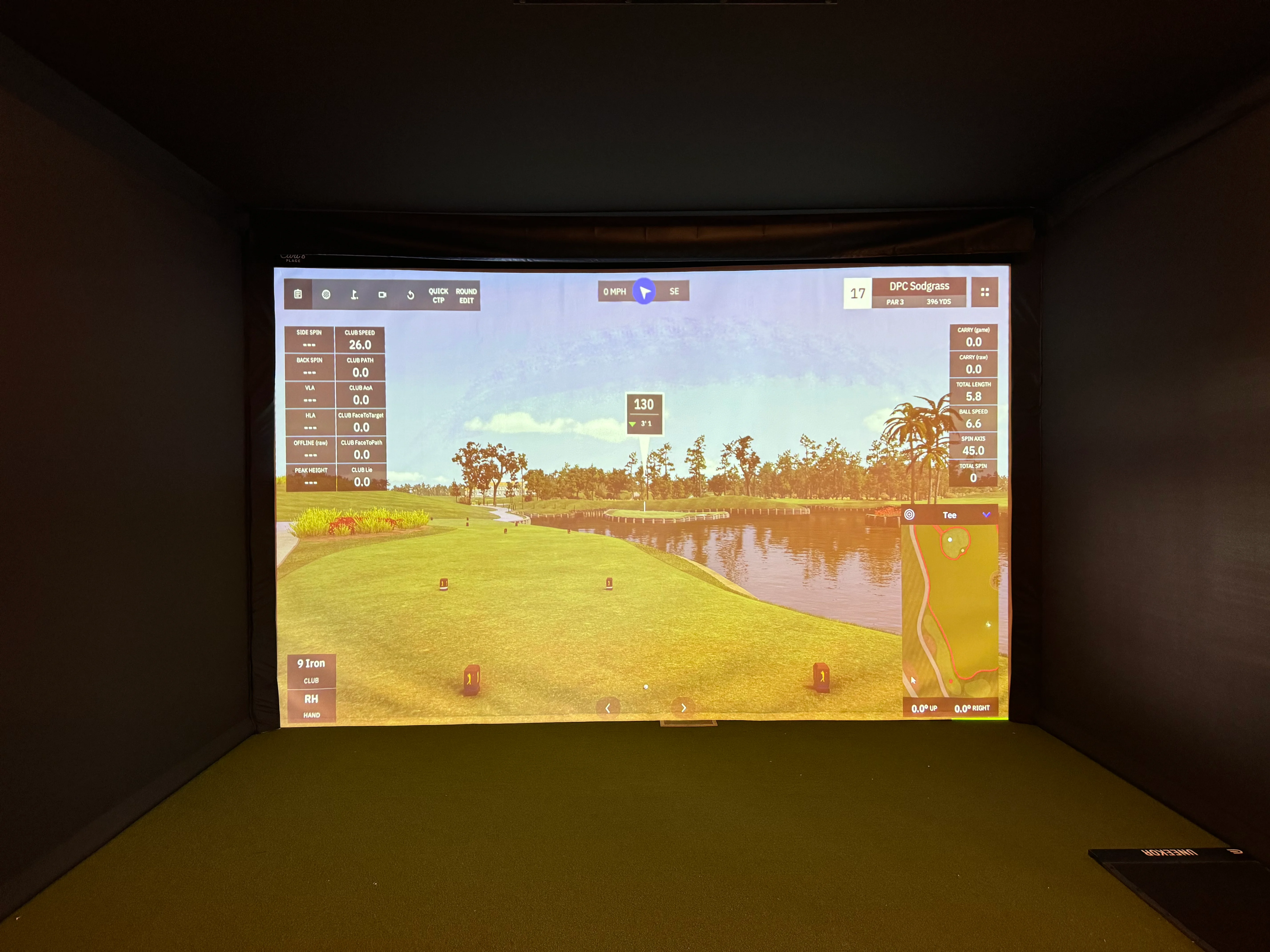 Golf simulator screen displaying a virtual course