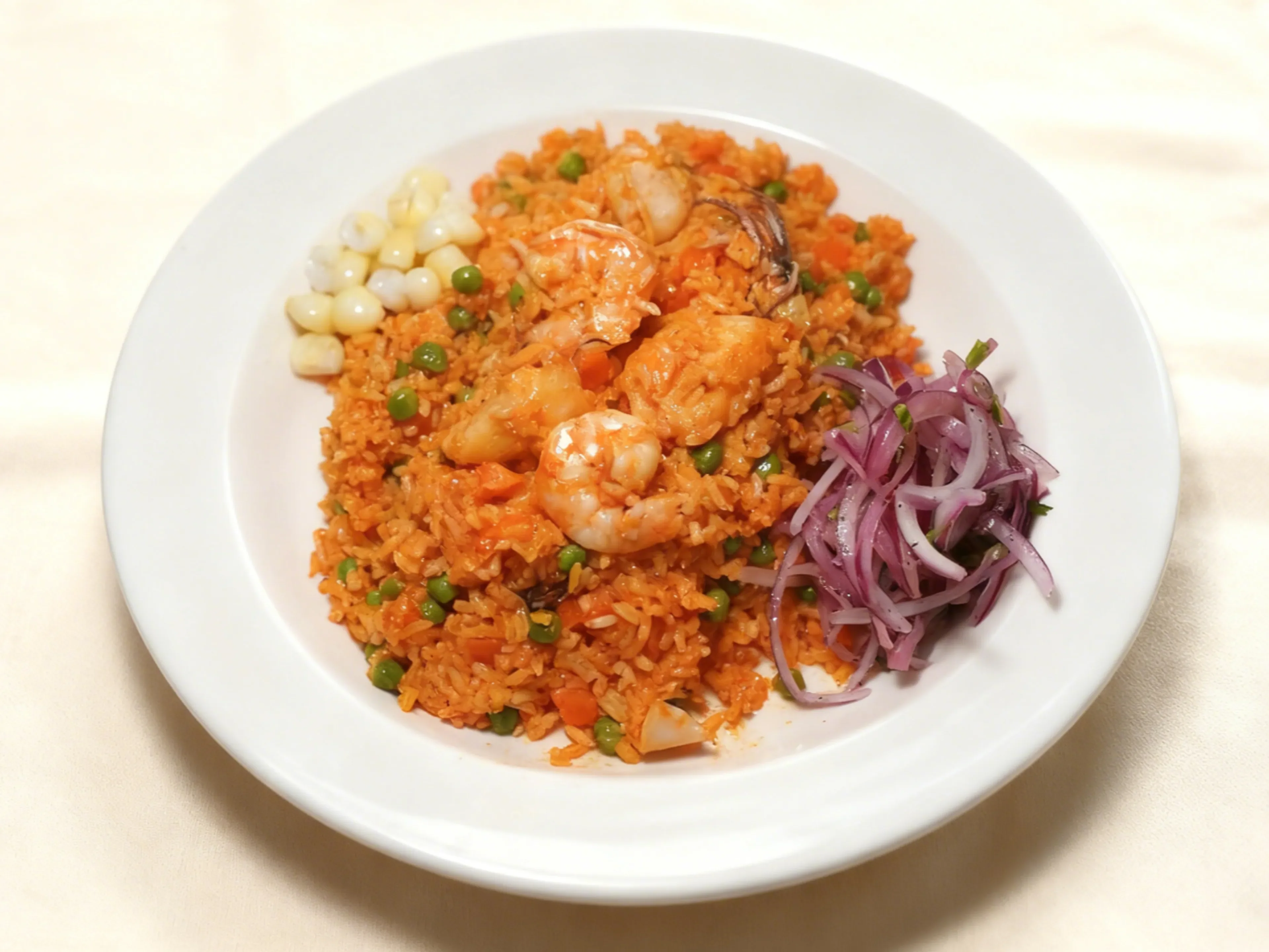 Peruvian arroz con mariscos with shrimp and vegetables