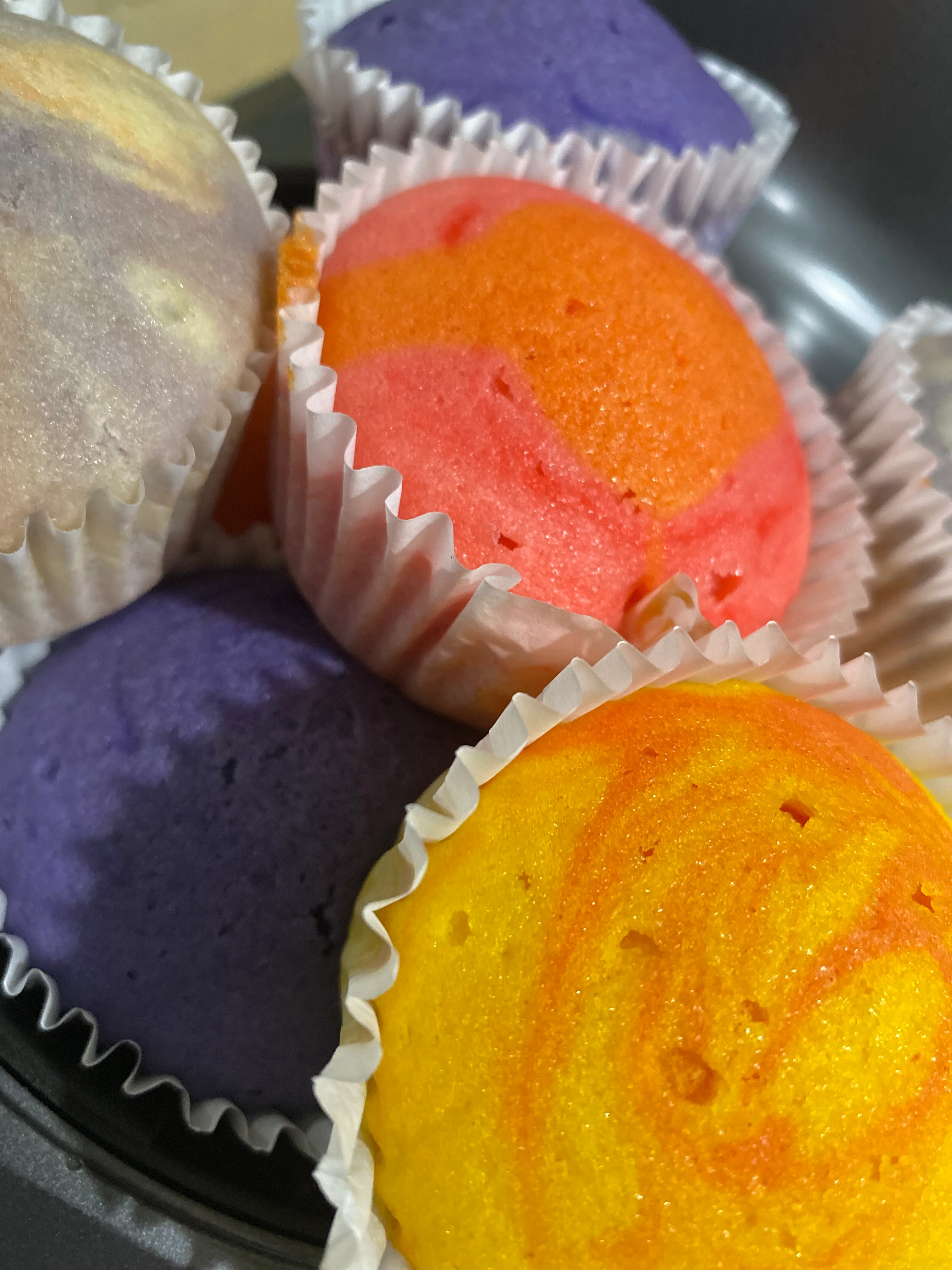 Colorful Filipino puto steamed rice cakes in assorted flavors