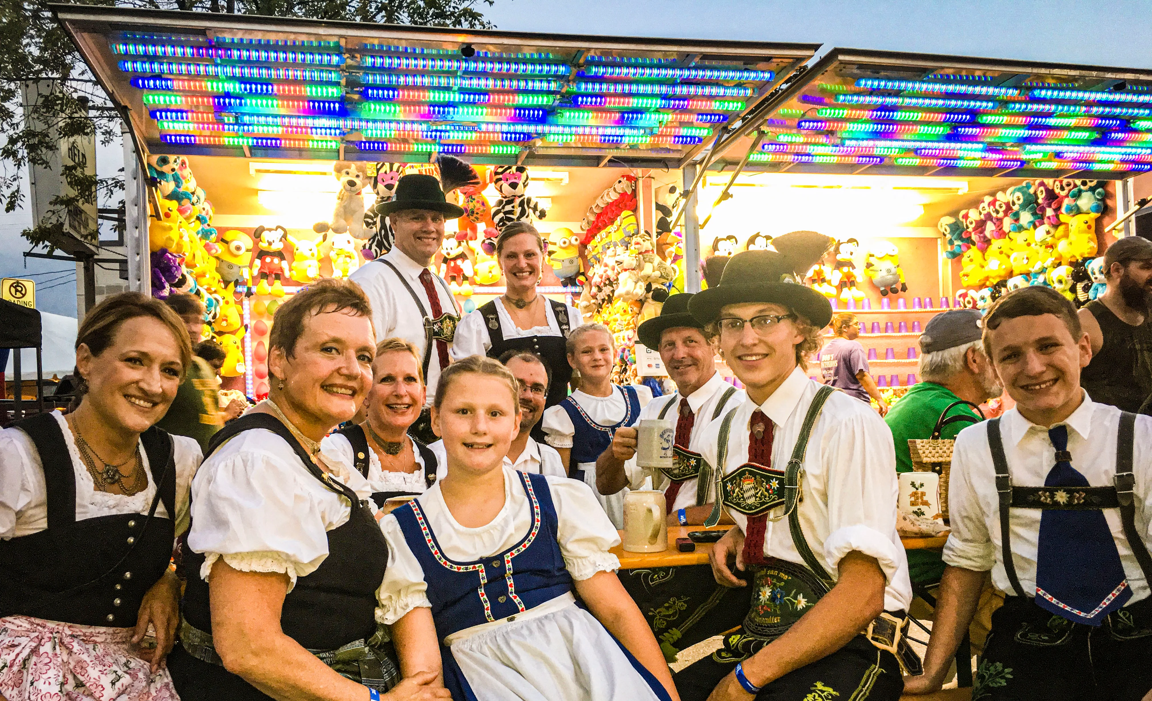 Group of people in traditional Bavarian attire at a festival