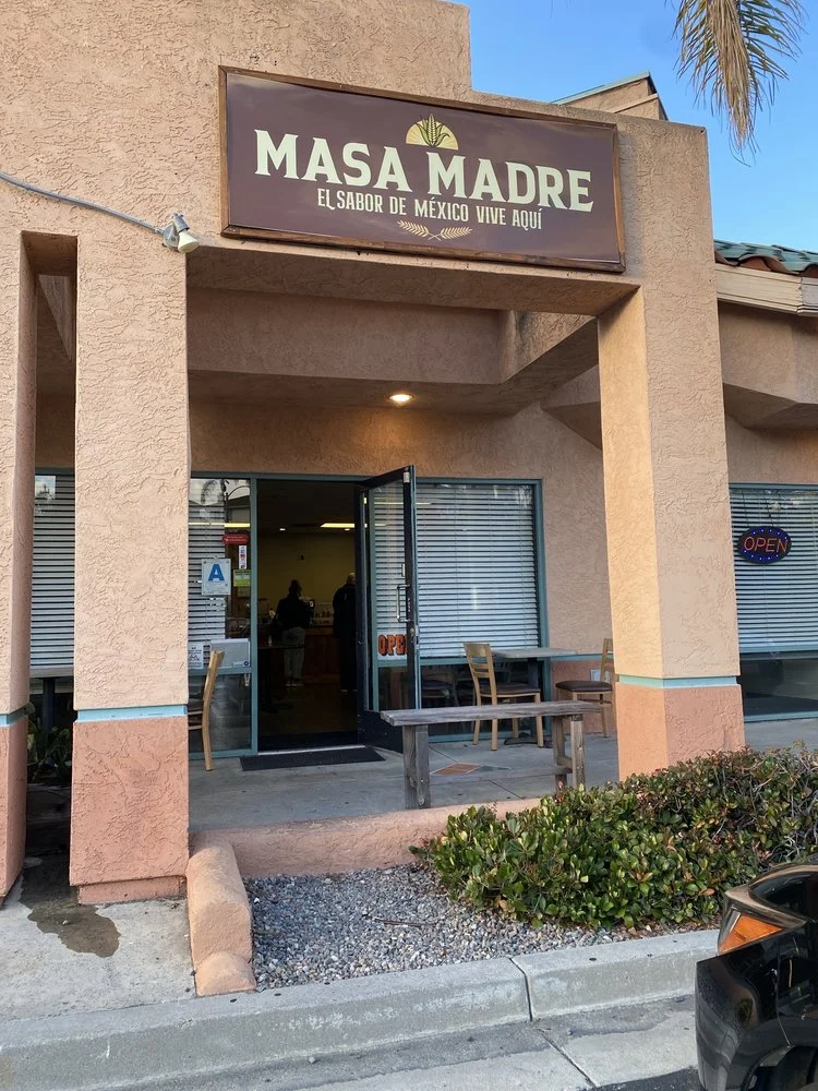 Exterior view of Masa Madre Mexican restaurant with open door