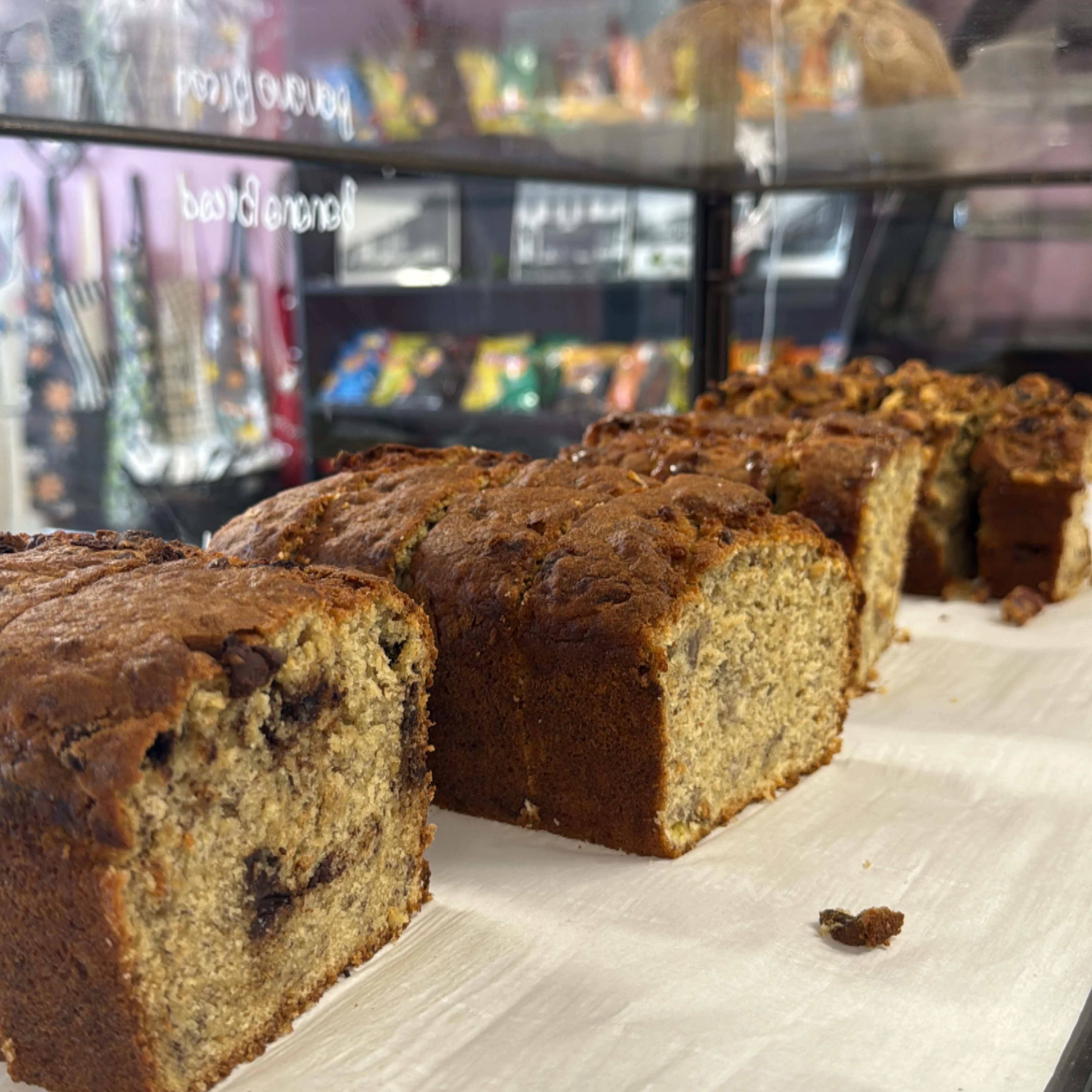 Freshly baked banana bread loaves on display