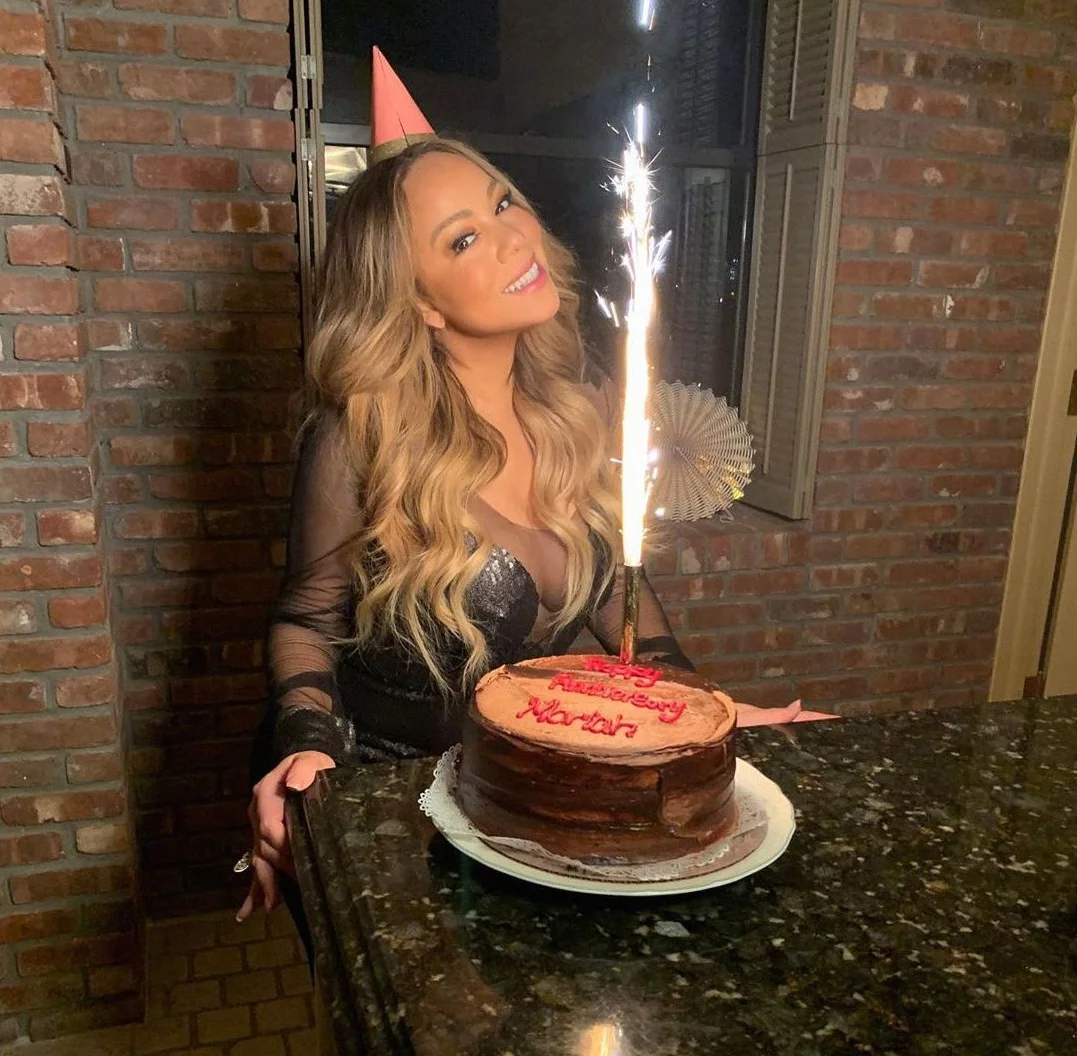 Celebratory birthday cake with sparkler and festive decor
