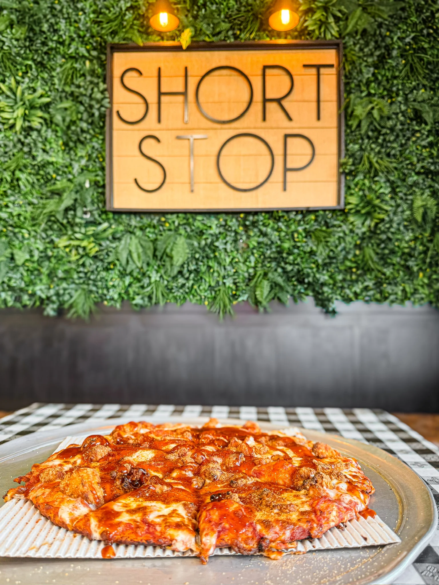 Delicious pepperoni pizza served in a vibrant restaurant setting