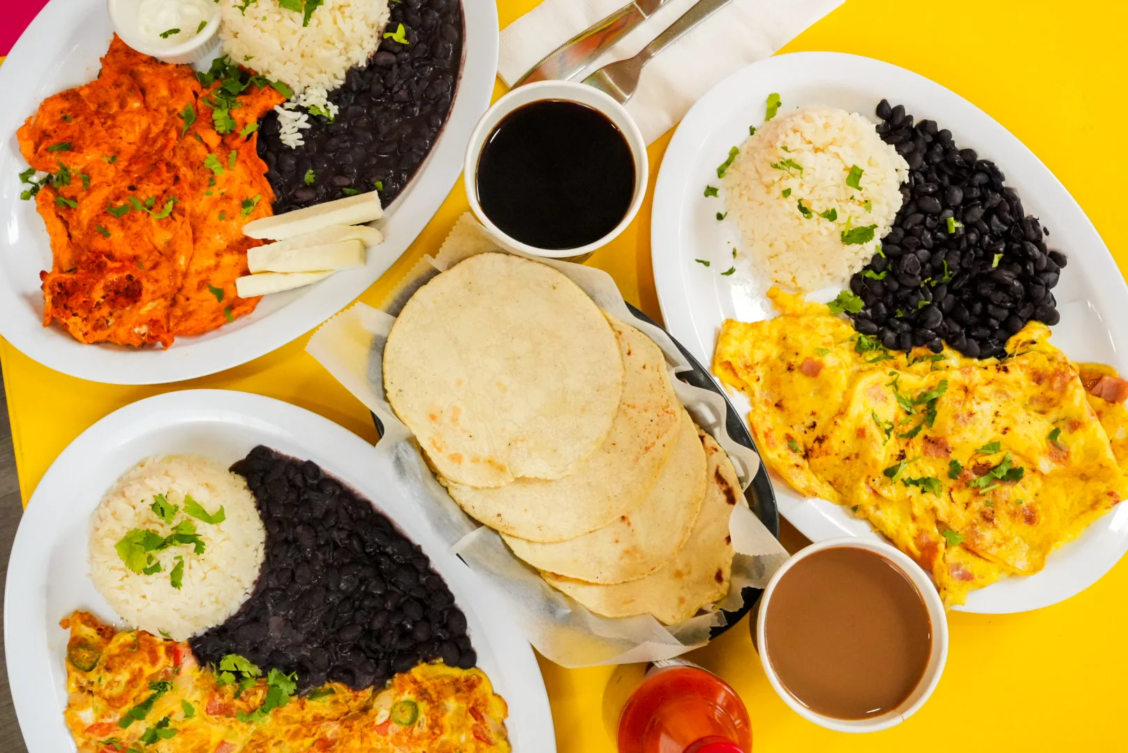Traditional Mexican breakfast with huevos rancheros and tortillas