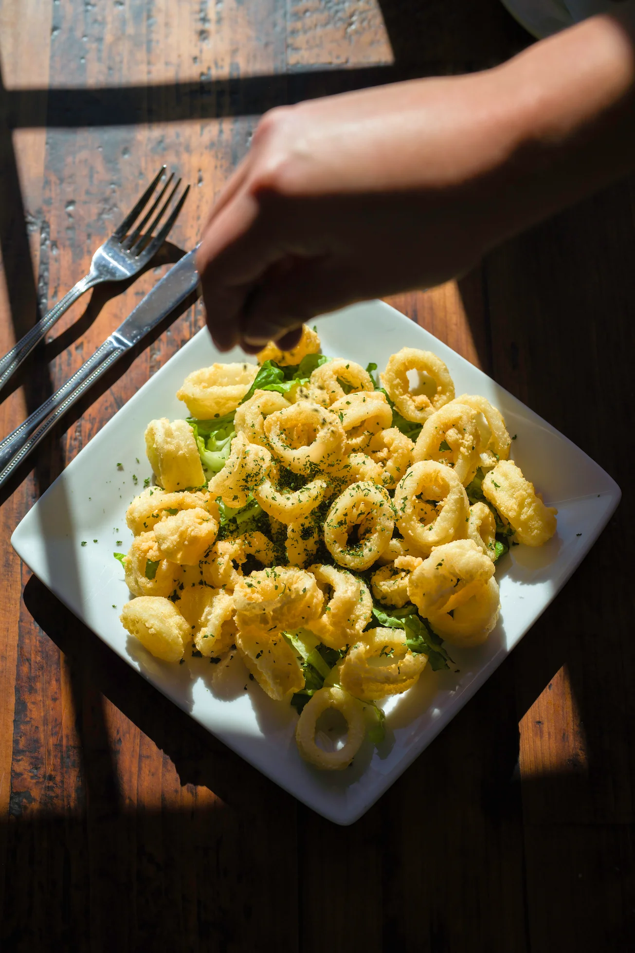 Crispy calamari served on a bed of greens