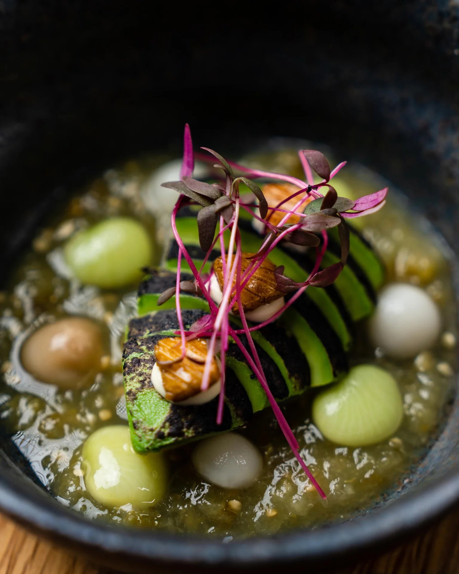 Grilled zucchini dish with vibrant garnishes