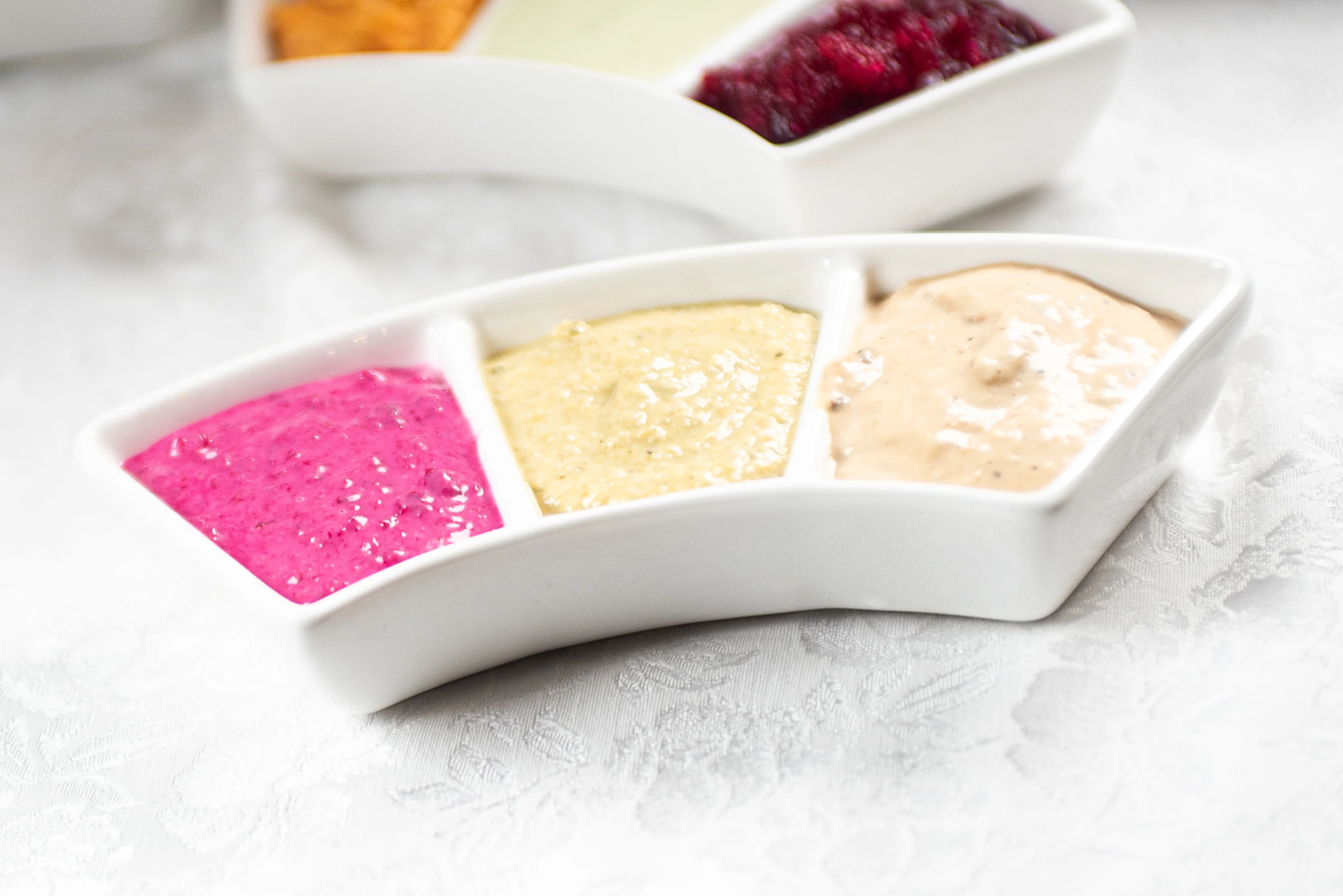 Colorful selection of Middle Eastern dips in a serving dish