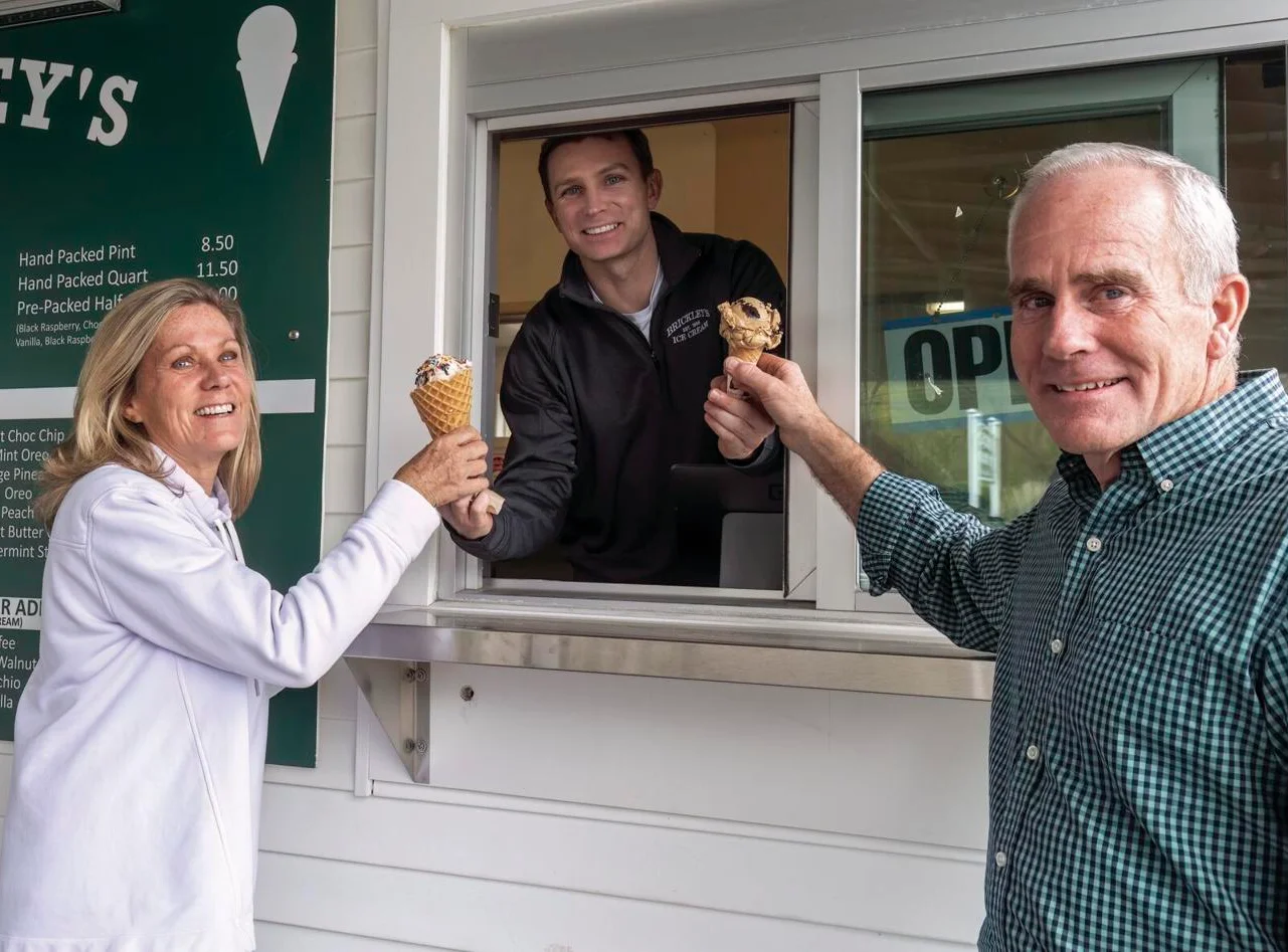 Customers enjoying ice cream at a service window