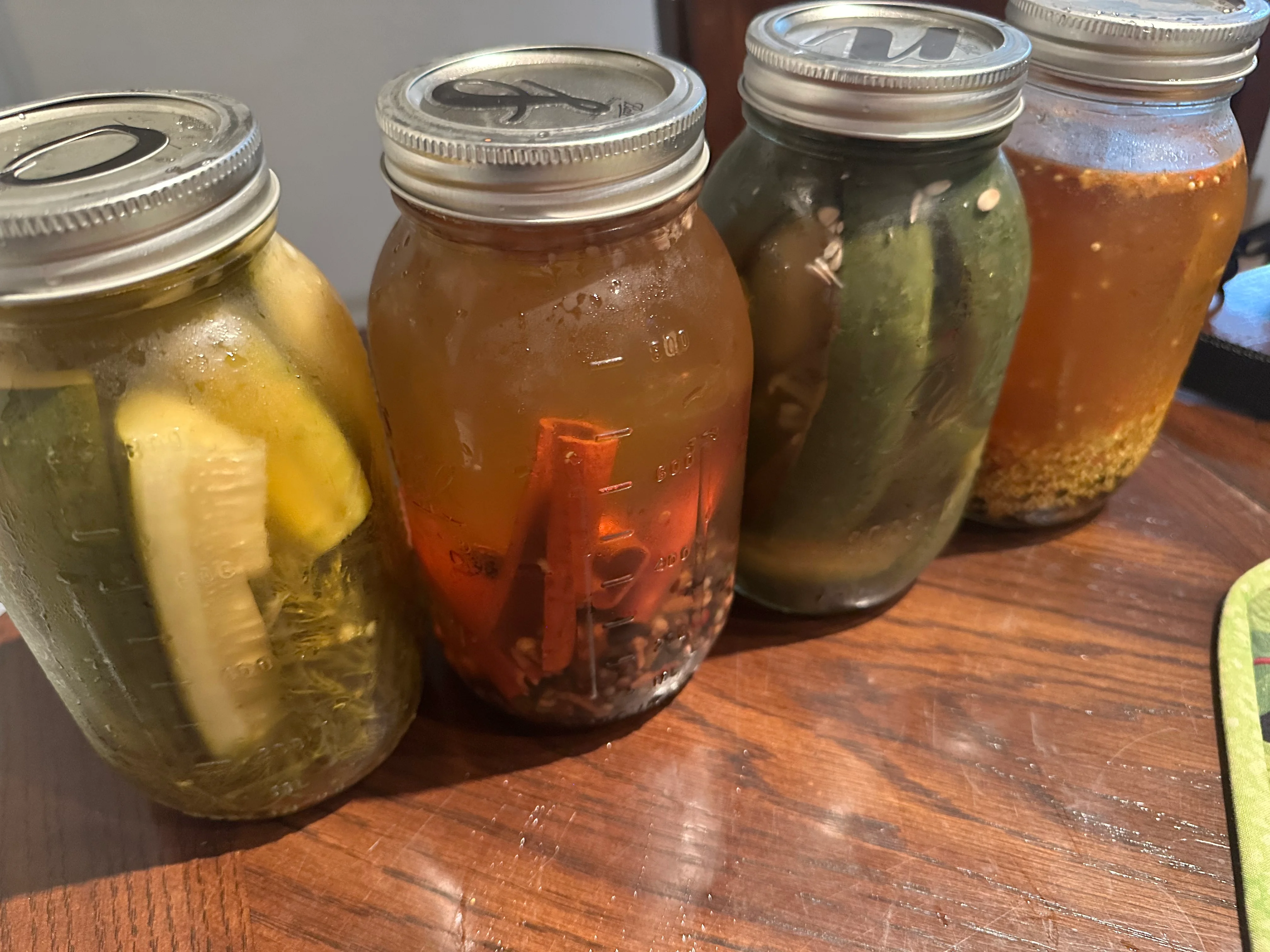 Assorted homemade pickles in mason jars