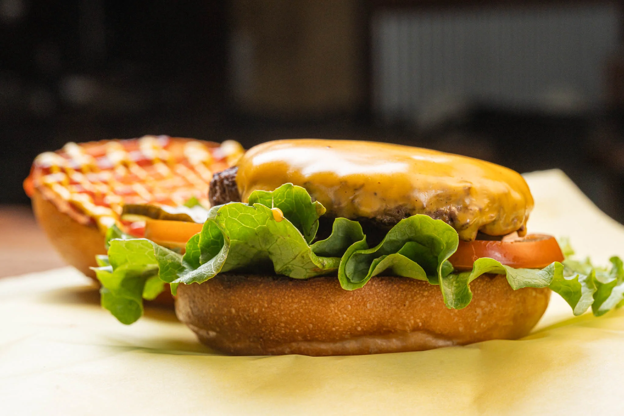 A delicious traditional Philly cheesesteak sandwich with melted cheese and toppings.