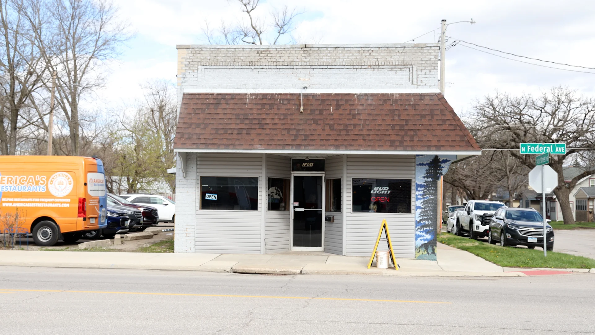 Charming restaurant exterior with open sign