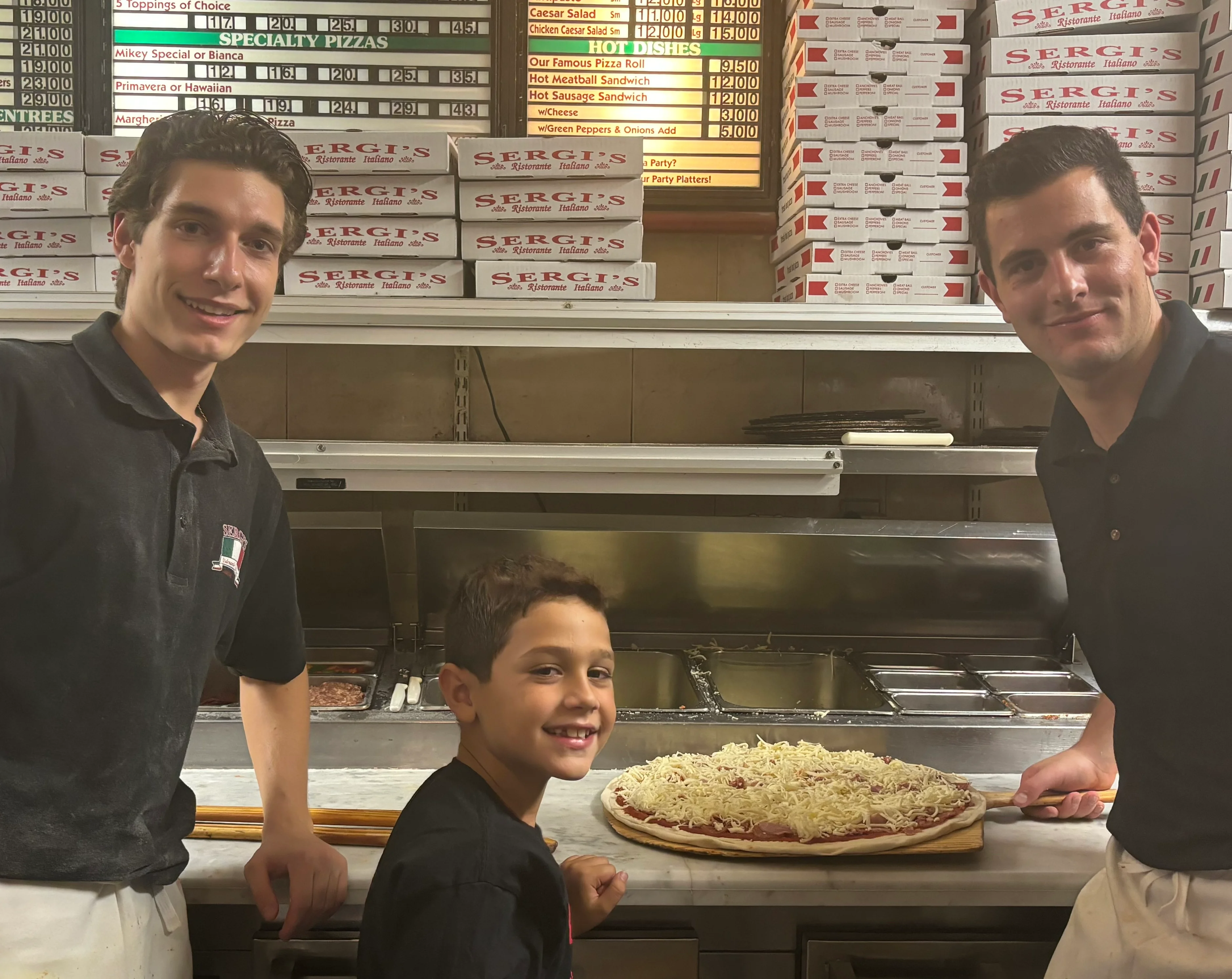 Experienced chef preparing pizza dough in a bustling kitchen