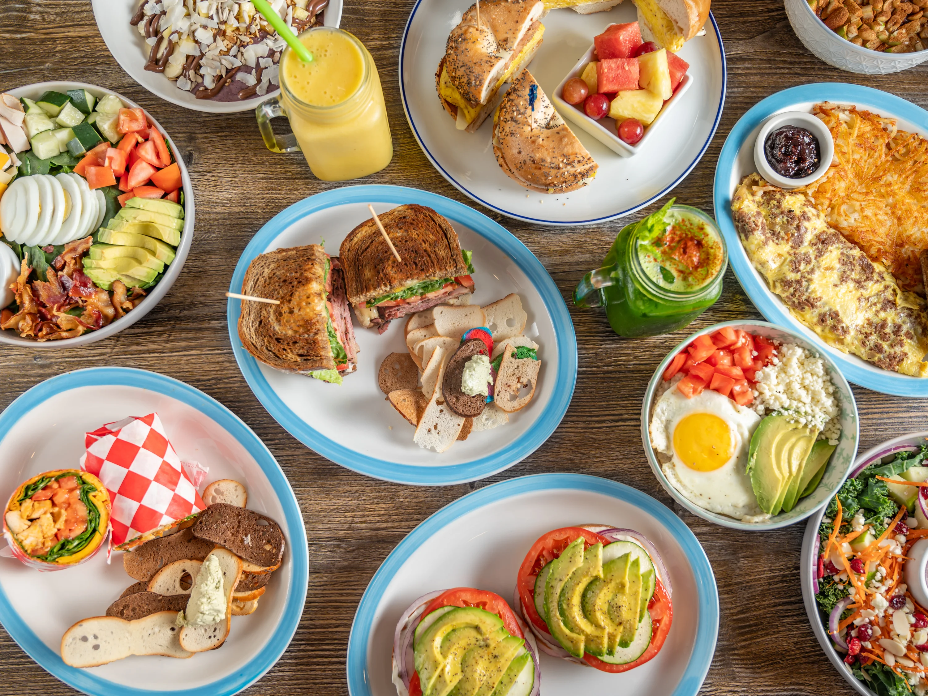 Variety of brunch dishes including sandwiches and salads