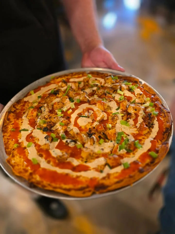 Delicious buffalo chicken pizza with drizzled sauce