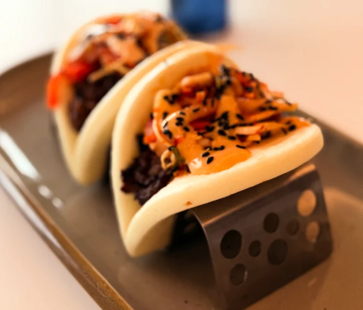 Delicious gourmet burger with fresh toppings on a wooden table
