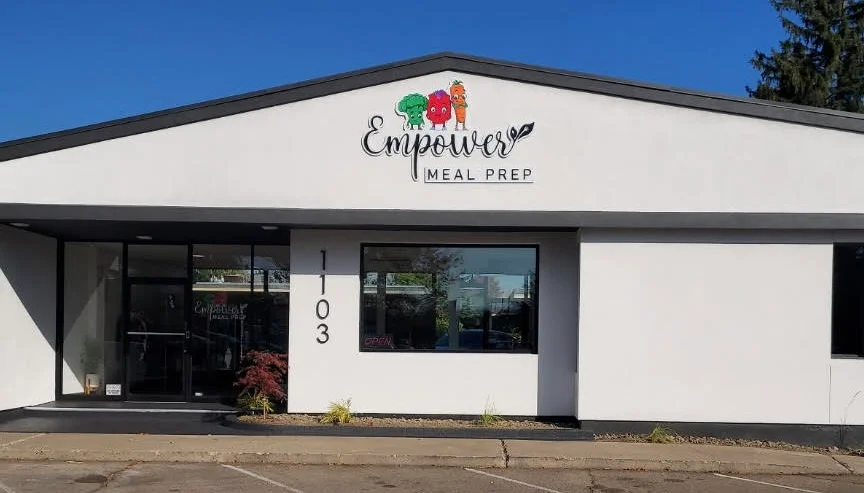 Exterior view of Empower Meal Prep facility with modern signage