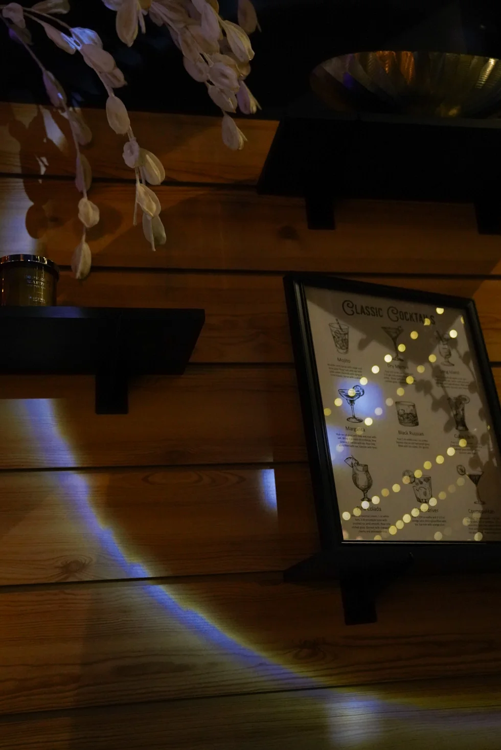 Classic cocktail menu displayed in a cozy bar setting