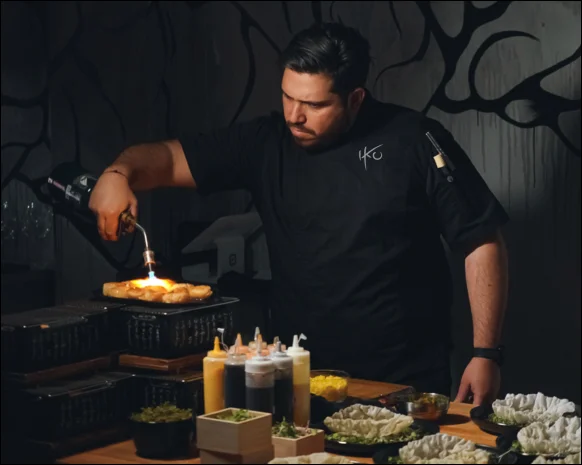 A restaurant chef preparing a dish