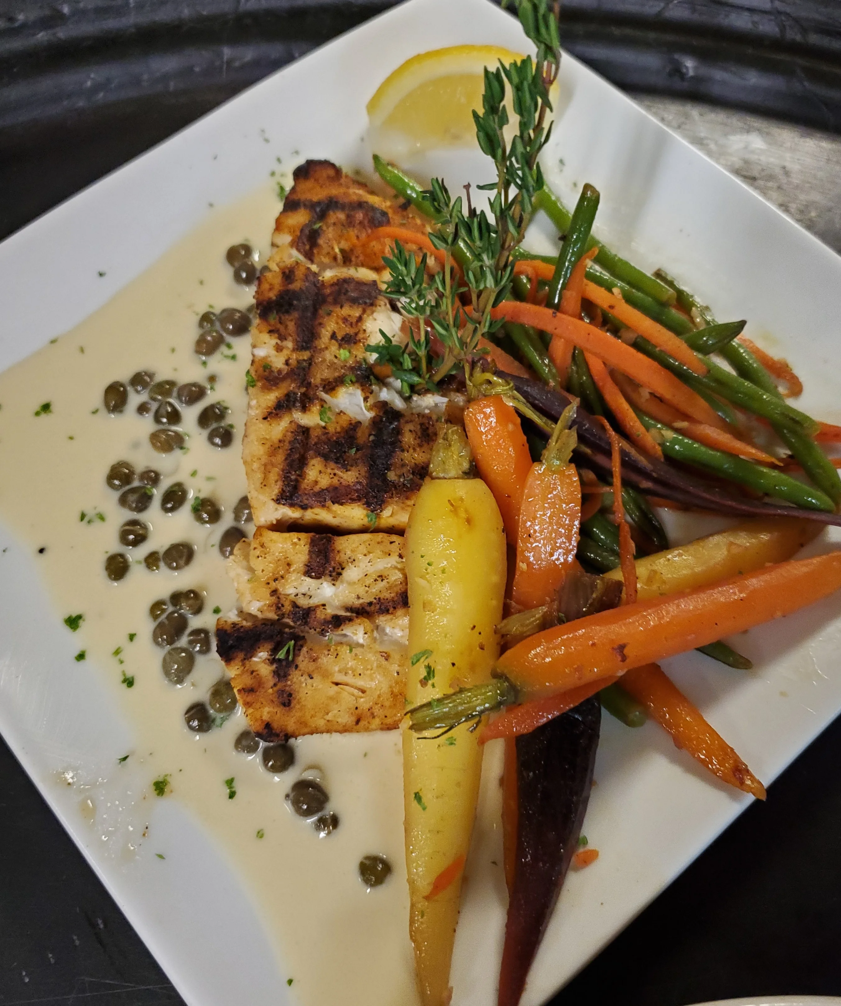 Grilled salmon with seasonal vegetables and lemon sauce