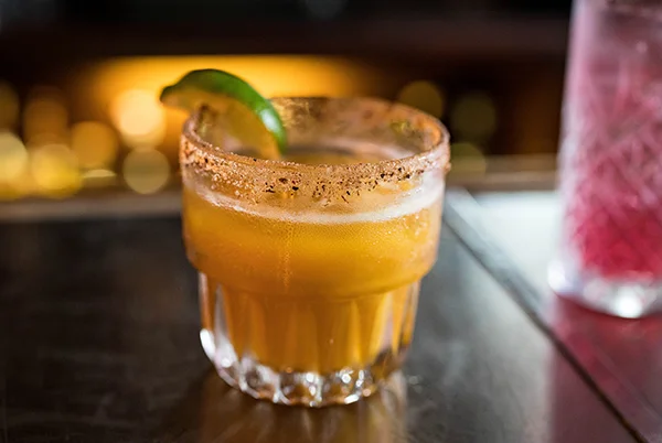 Refreshing margarita cocktail with lime garnish