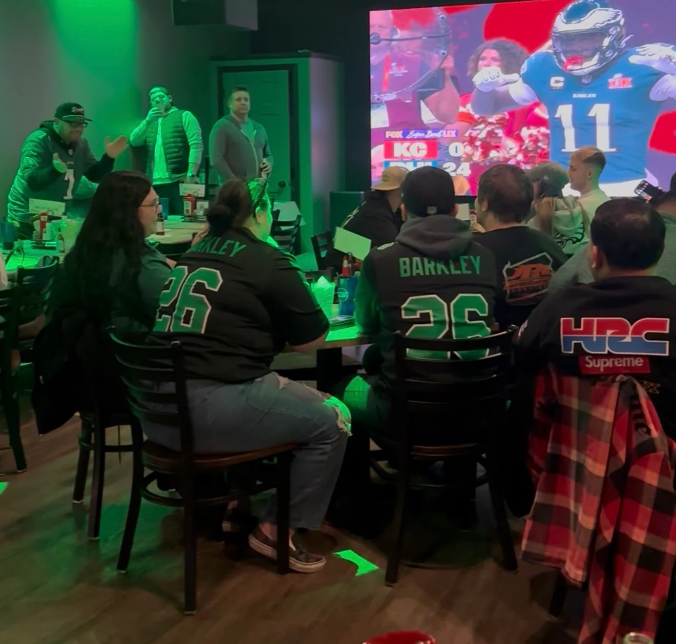 A vibrant football-themed gathering with food and drinks for game day.