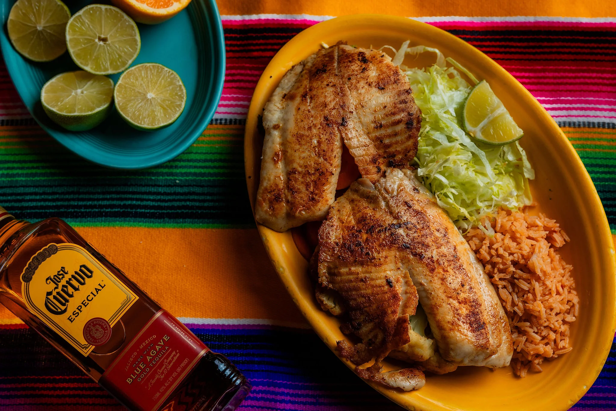 Grilled fish tacos served with rice and fresh lime