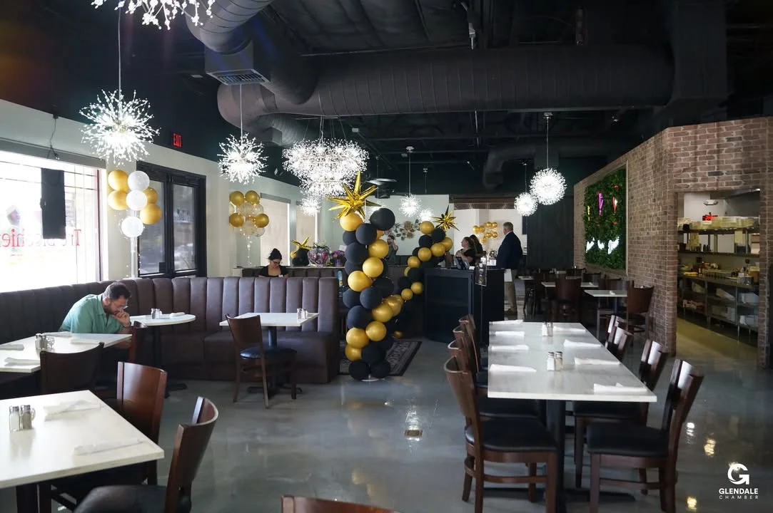 Stylish restaurant interior with festive decor and cozy seating