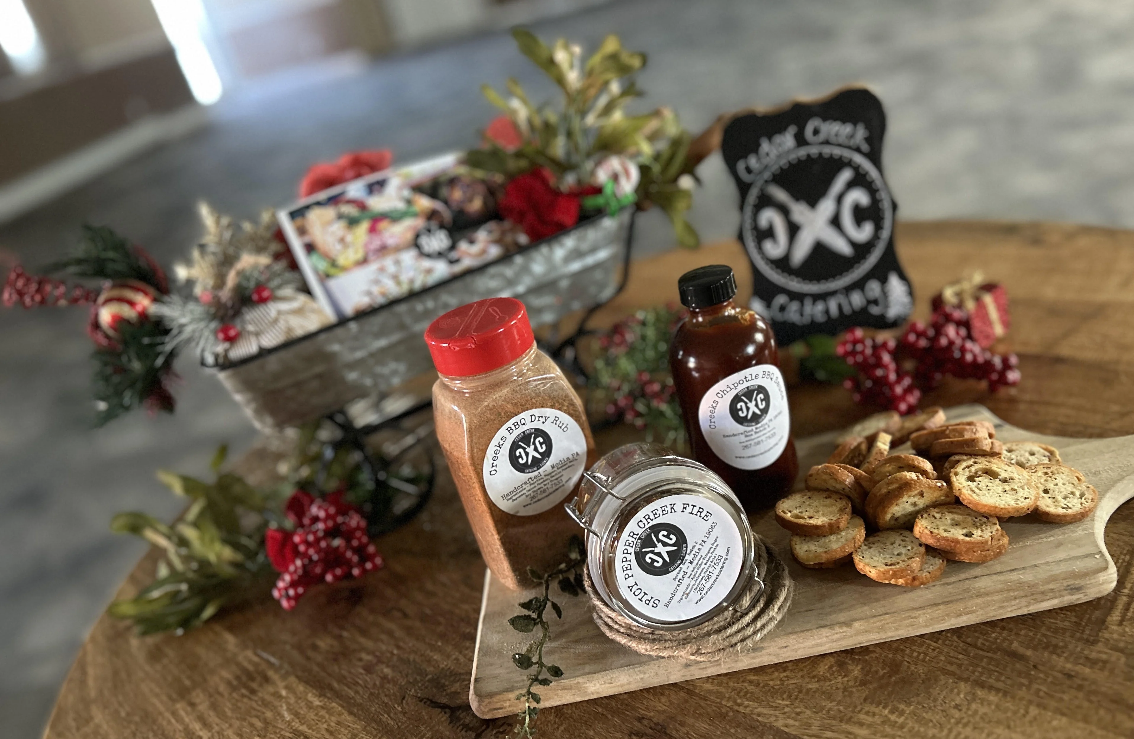 Catering display with BBQ rubs and snacks on a wooden table