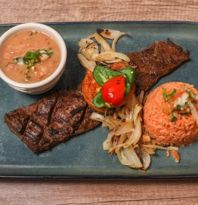 Mexican carne asada plate with rice and beans