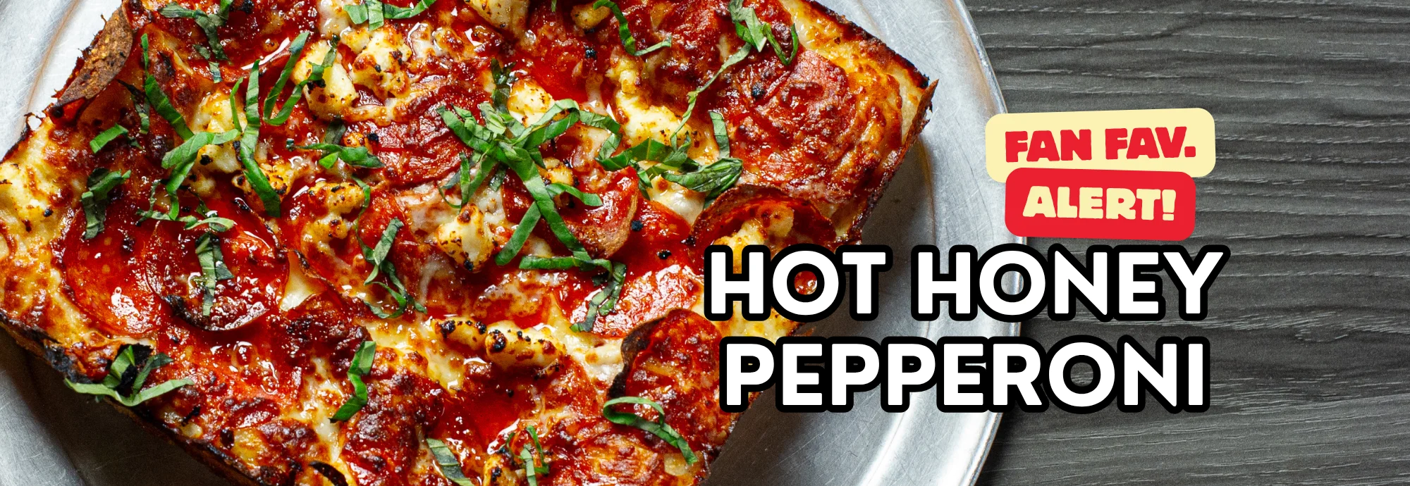 Hot honey pepperoni pizza on a metal tray