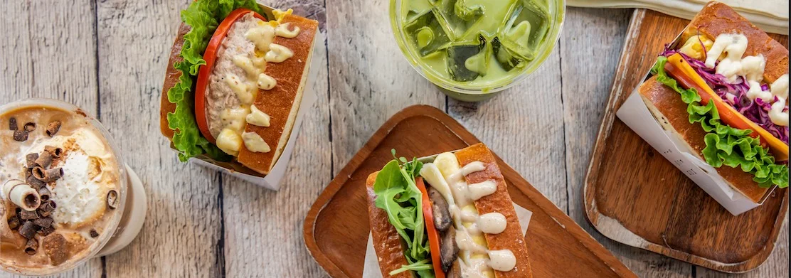 Gourmet sandwiches with fresh toppings and iced beverages