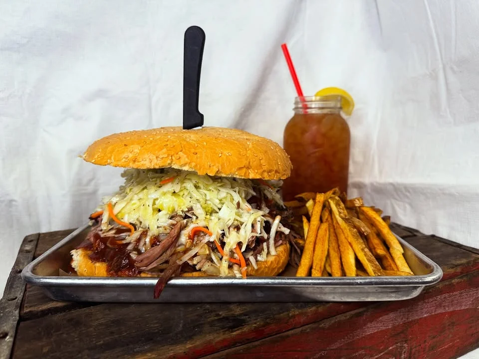 Pulled pork sandwich with coleslaw and sweet potato fries