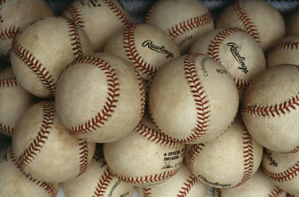 Collection of baseballs stacked together