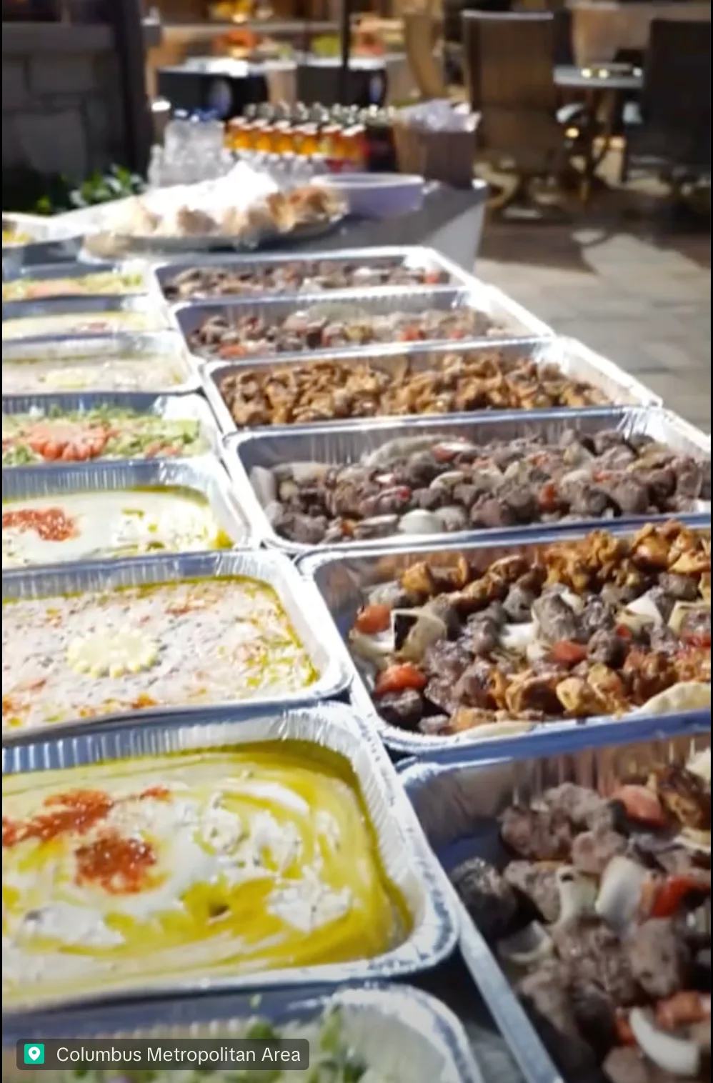 Assorted Middle Eastern dishes in aluminum trays