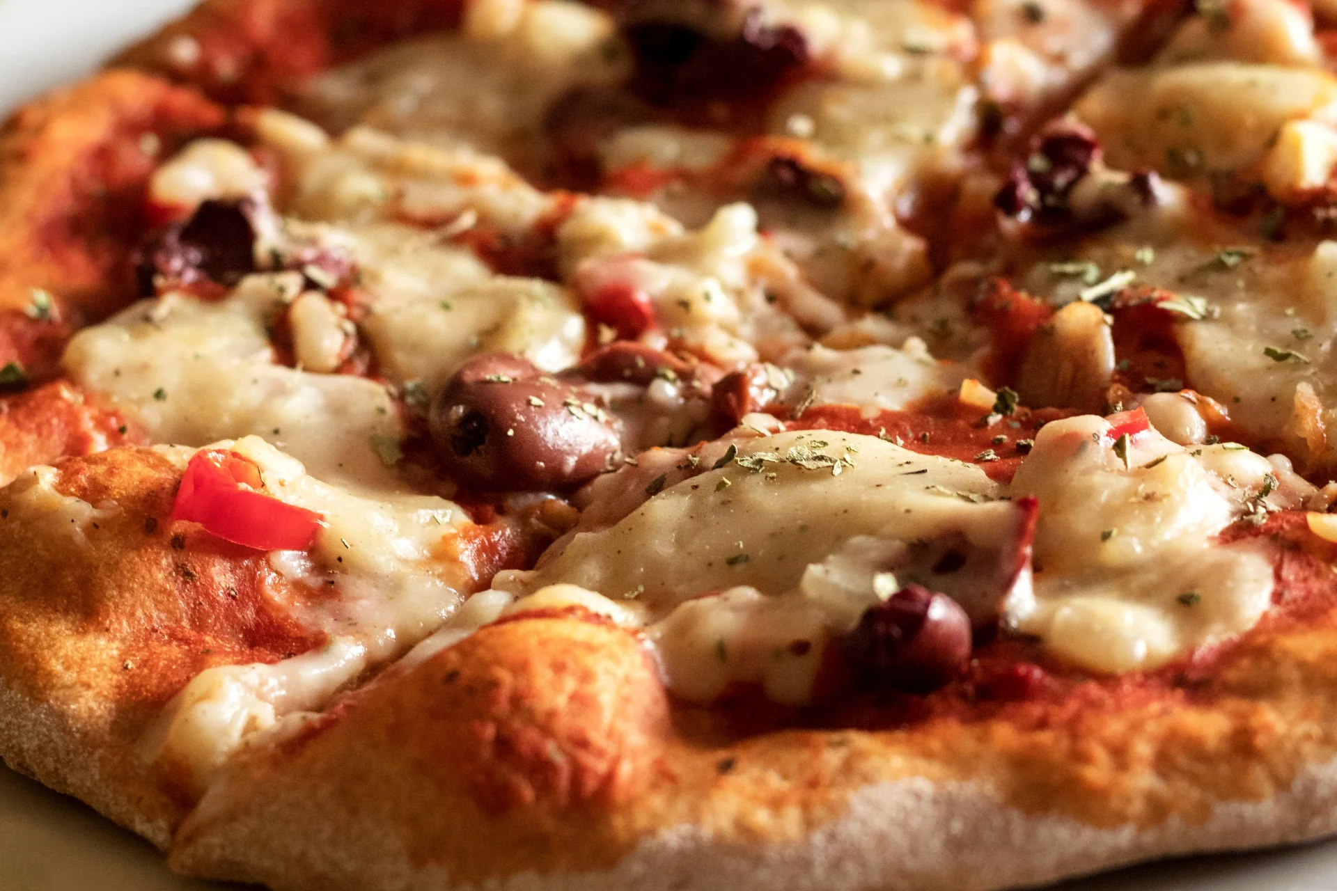 Delicious Mediterranean pizza topped with cheese and olives