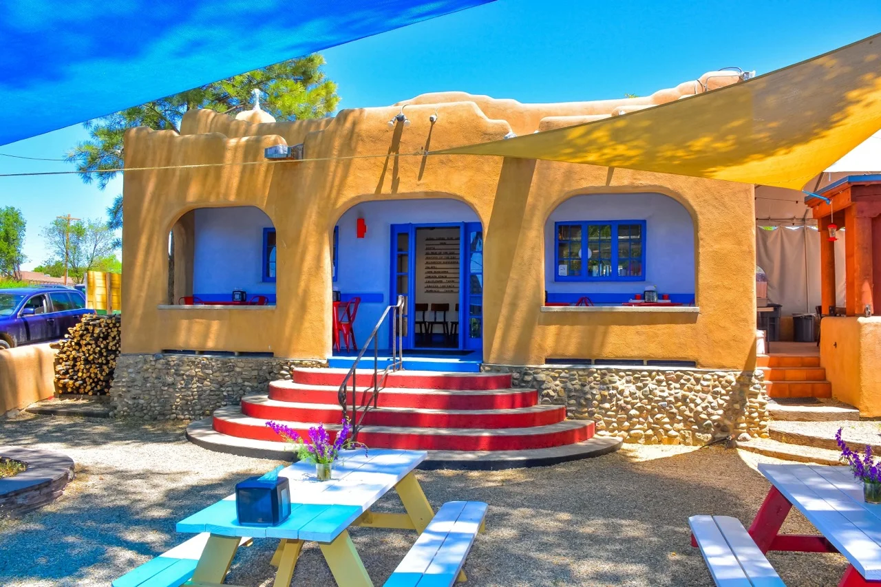 Charming adobe restaurant exterior with colorful accents